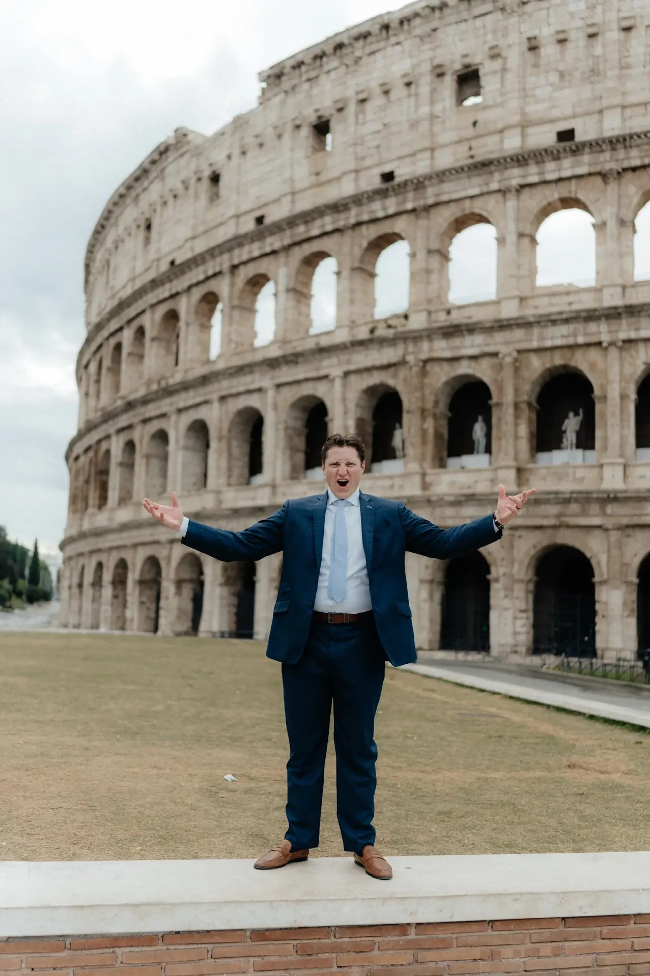 Groom in custom wedding suit by esatto Custom during outdoor ceremony in Italy