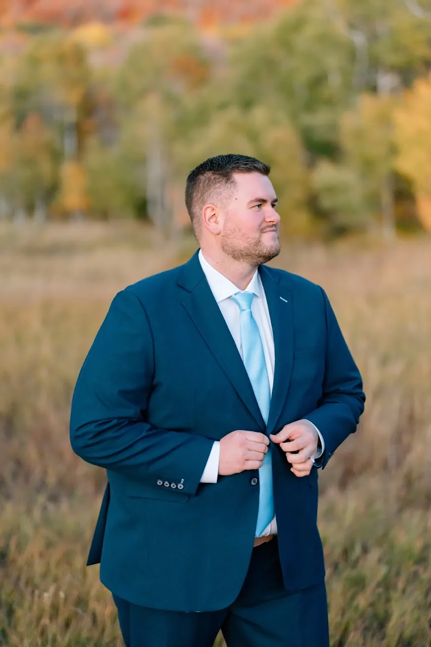 Man in a bright blue custom suit with a light blue tie by esatto Custom, Layton, Utah