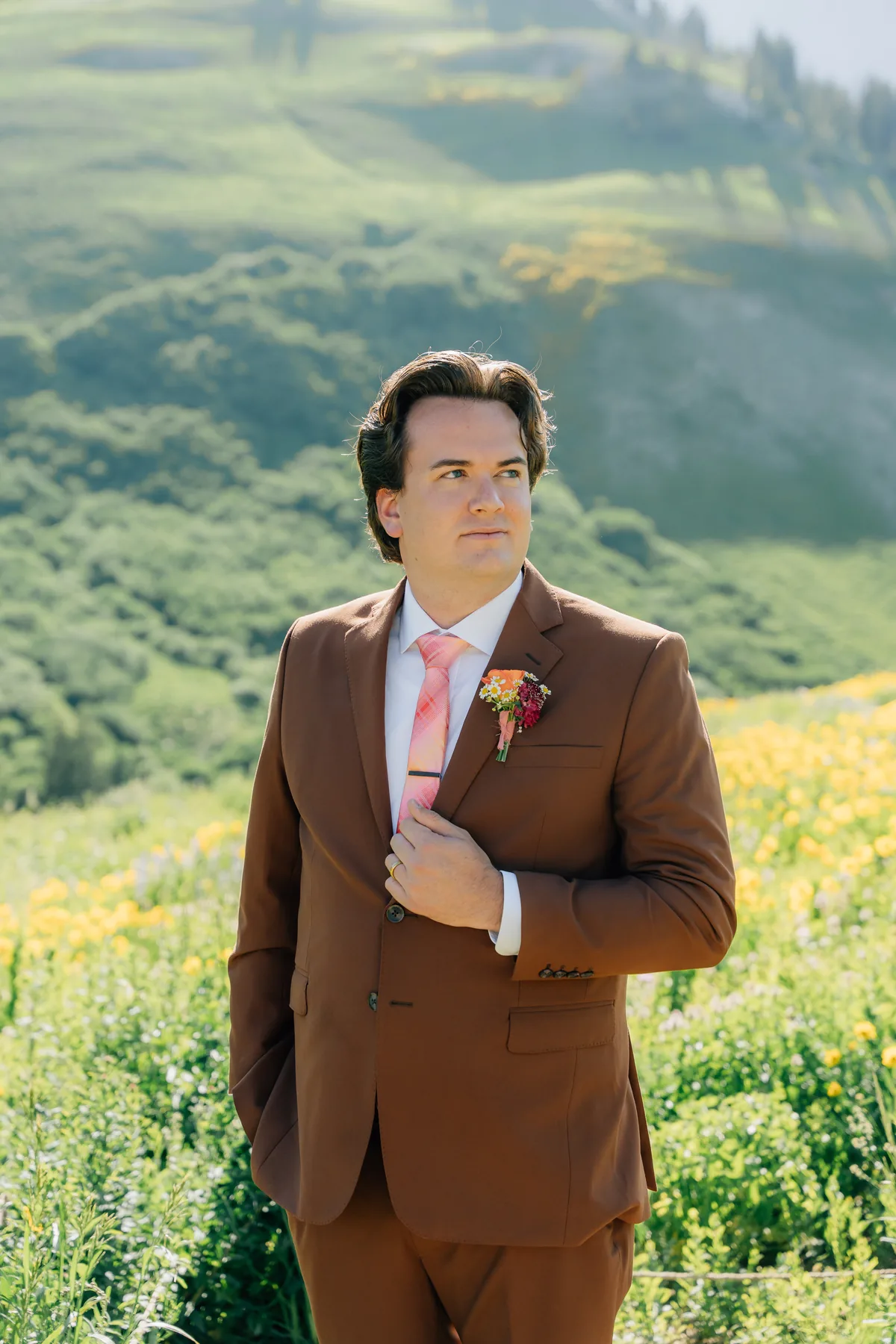 Groom in a terra-cotta brown custom suit and pink tie by esatto Custom, Layton, Utah